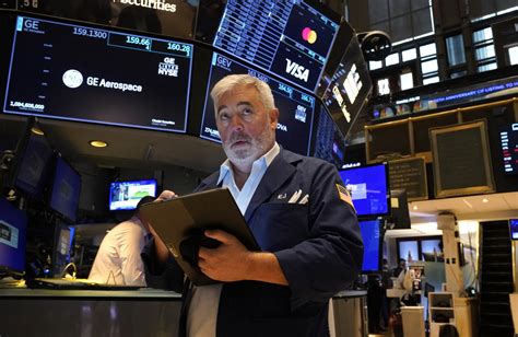Stock market today: Dow ekes out another record as investors .